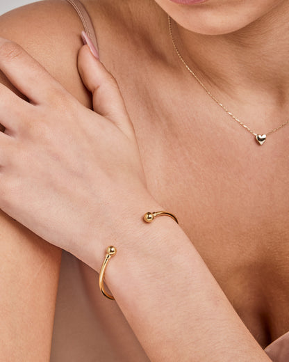 9K Yellow Gold 2.5mm Tube 62mm x 50mm Torque Bangle