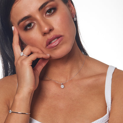 Model wearing 1.45ct Lab Grown Diamond Halo Earrings in 18K White Gold