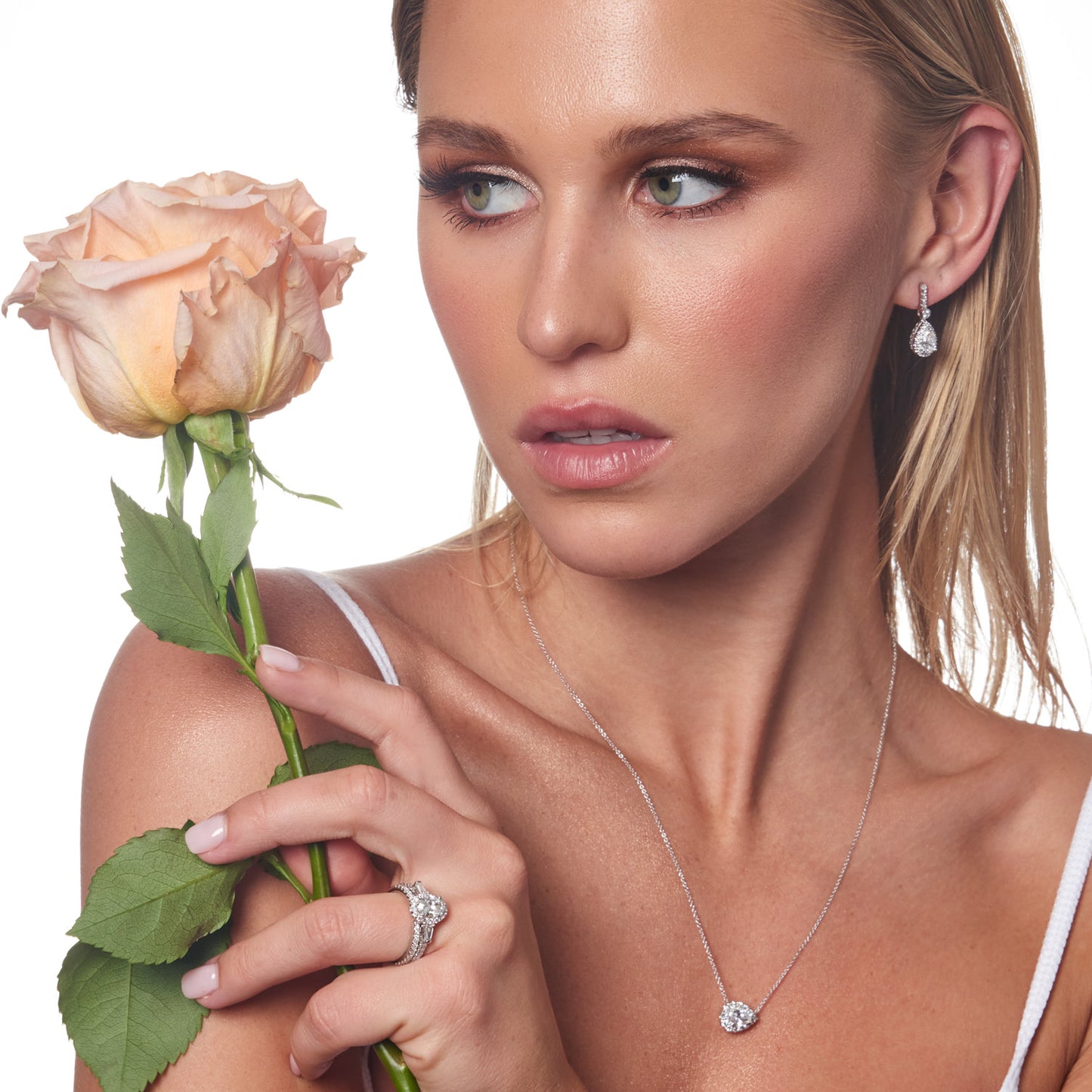 Model wearing 1.47ct Lab Grown Diamond Halo Earrings in 18K White Gold