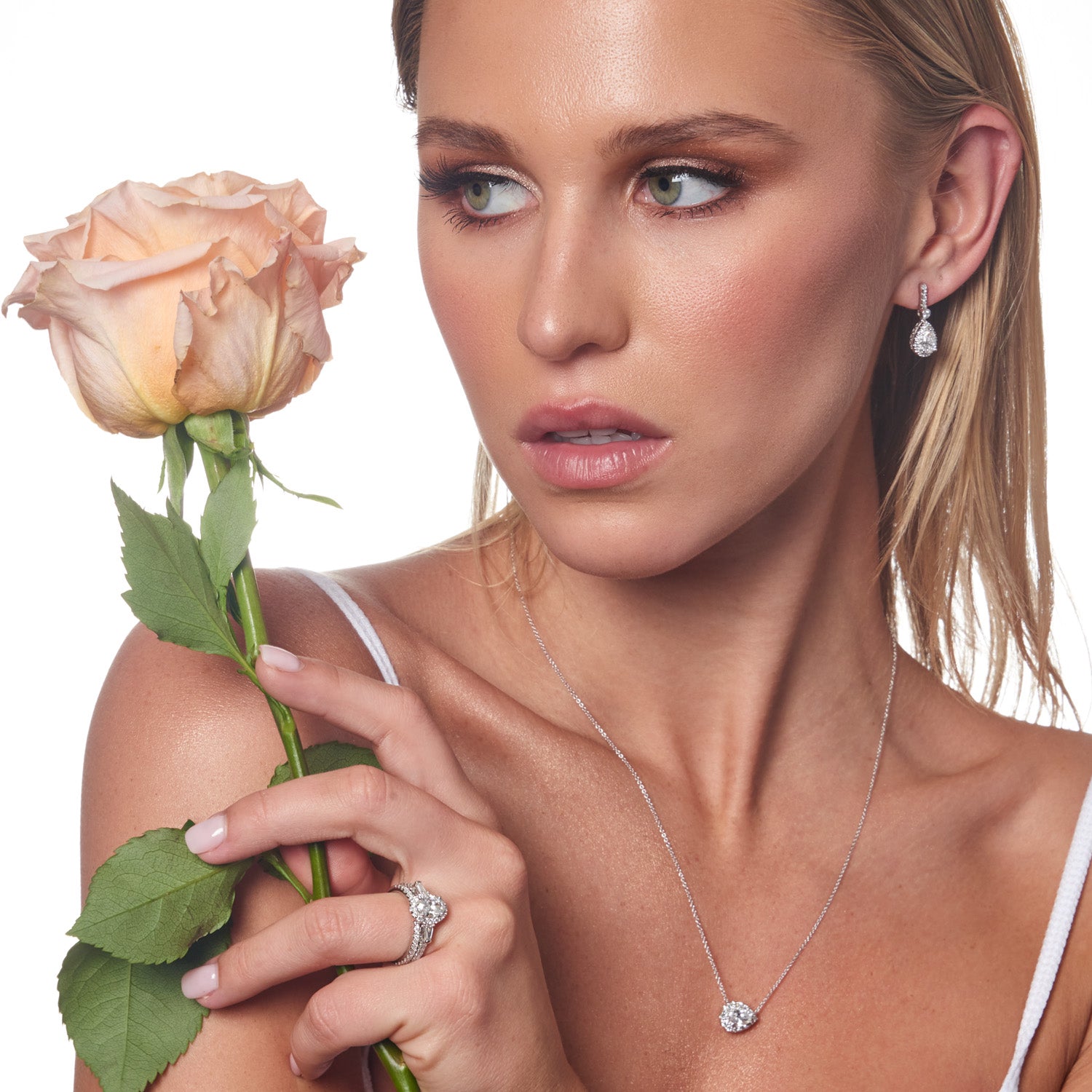 Model wearing 1.47ct Lab Grown Diamond Halo Earrings in 18K White Gold