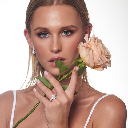 Model wearing 1.47ct Lab Grown Diamond Halo Earrings in 18K White Gold