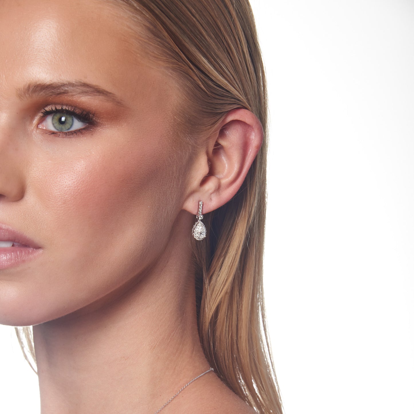 Model wearing 1.47ct Lab Grown Diamond Halo Earrings in 18K White Gold