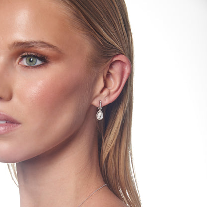 Model wearing 1.47ct Lab Grown Diamond Halo Earrings in 18K White Gold