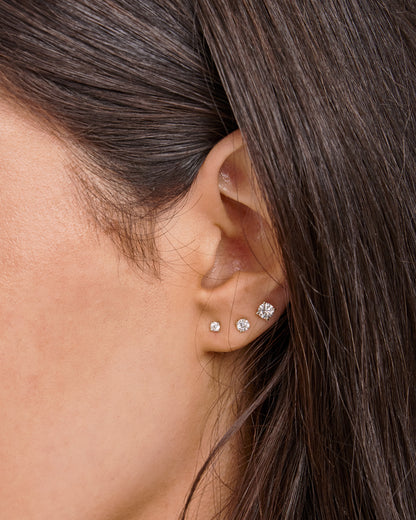 Model wearing 0.25ct Lab Grown Diamond Stud Earrings in 9K White Gold