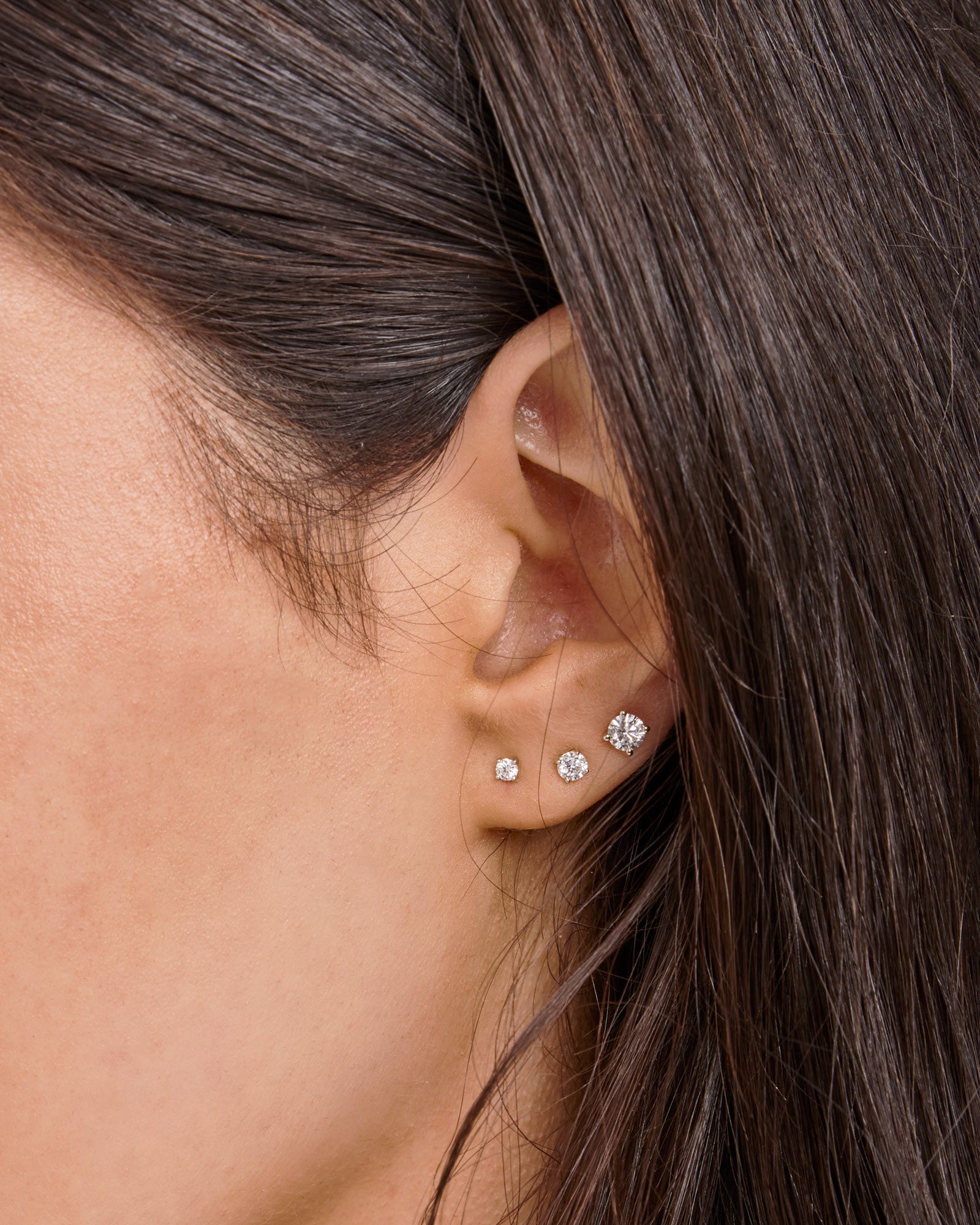 Model wearing 0.50ct Lab Grown Diamond Stud Earrings in 9K White Gold