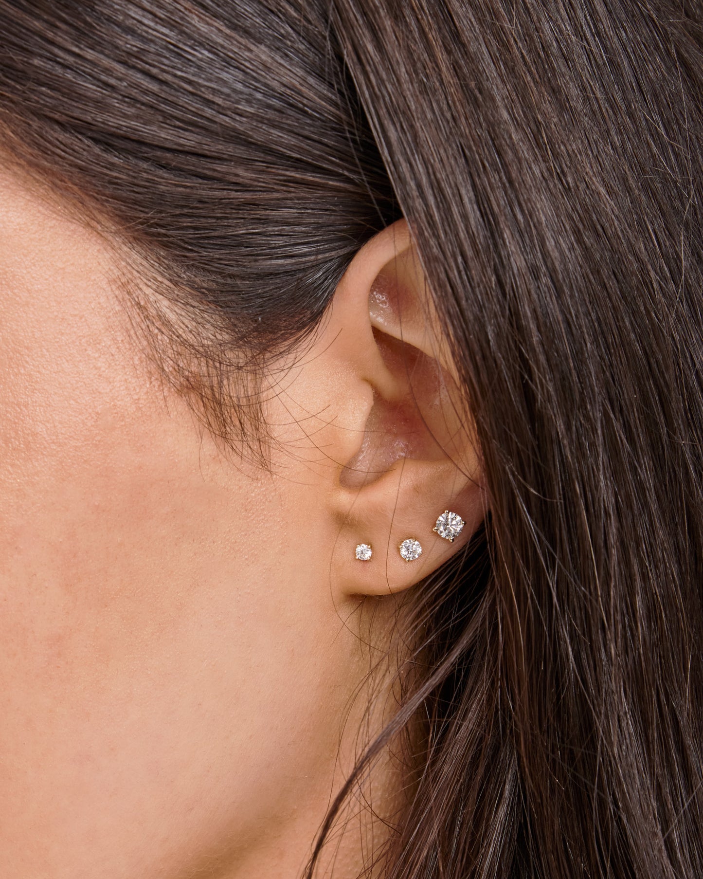 Model wearing 0.50ct Lab Grown Diamond Stud Earrings in 9K Yellow Gold