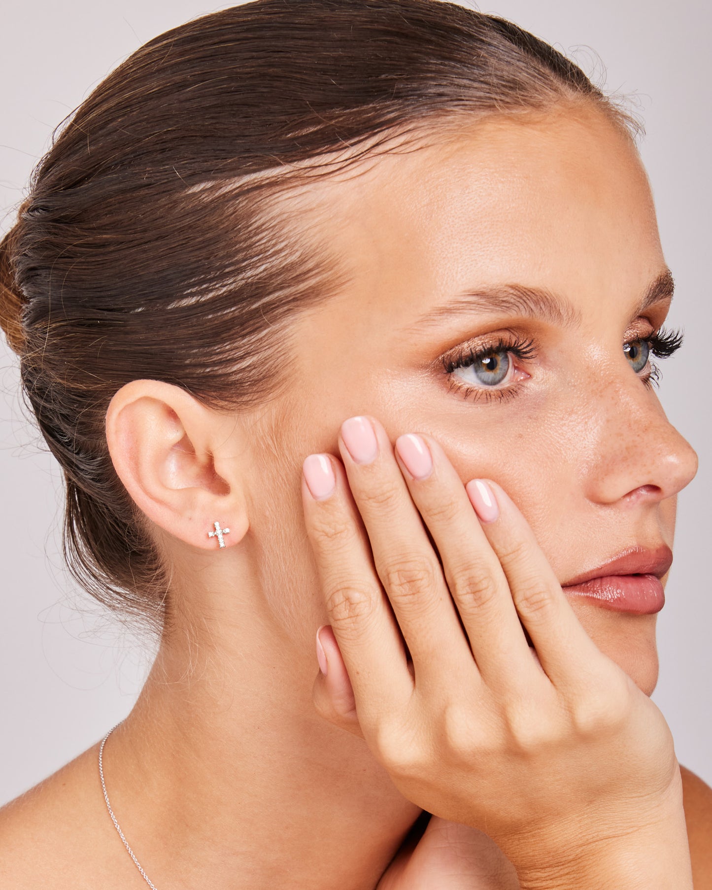 Model wearing 0.10ct Lab Grown Diamond Stud Earrings in 9K White Gold