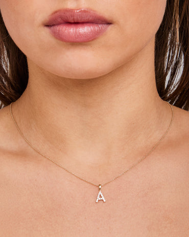 Model wearing A INITIAL 0.14ct Lab Grown Diamond Pendant in 9K Yellow Gold
